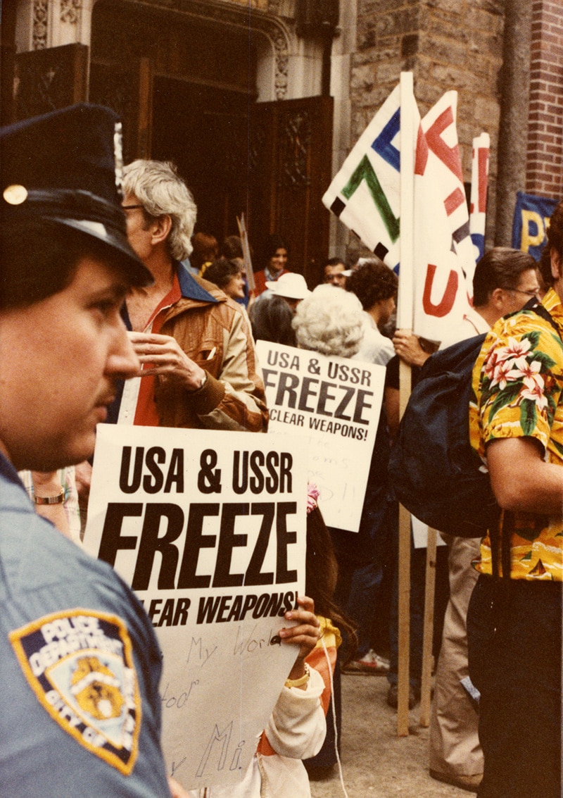 1982 marchers holding "USA & USSR Freeze Nuclear Weapons" signs